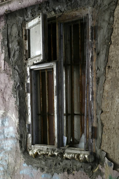 The broken window in the deserted house