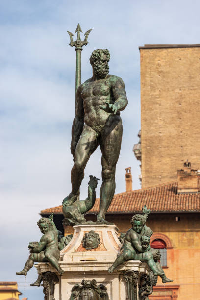 Bronze Statue of Neptune the Roman God - Bologna Italy Bronze statue of Neptune (1566), Roman God, fountain in Piazza del Nettuno, Bologna downtown, Emilia-Romagna, Italy, Europe. Artist Giambologna (1529-1608) poseidon statue stock pictures, royalty-free photos & images