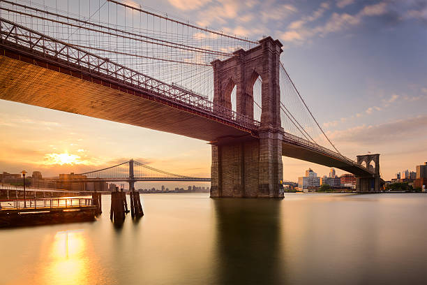 Brooklyn Bridge at Dawn Brooklyn Bridge in New York City at sunrise. brooklyn bridge stock pictures, royalty-free photos & images
