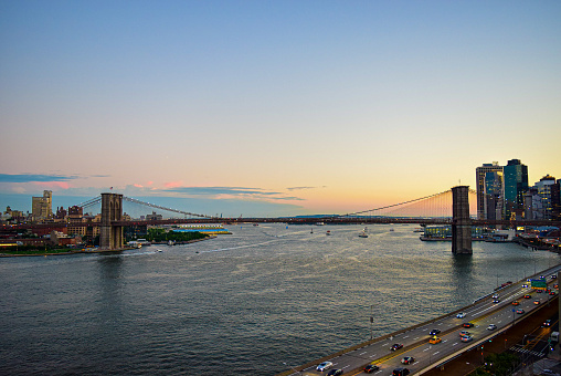 Manhattan Bridge with Manhattan New York City skyscrapers city skyline over Hudson River USA