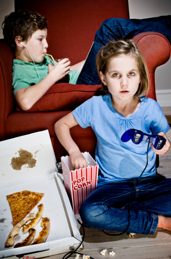 Brother And Sister Addicted To Tv And Junk Food Stock Photo - Download ...