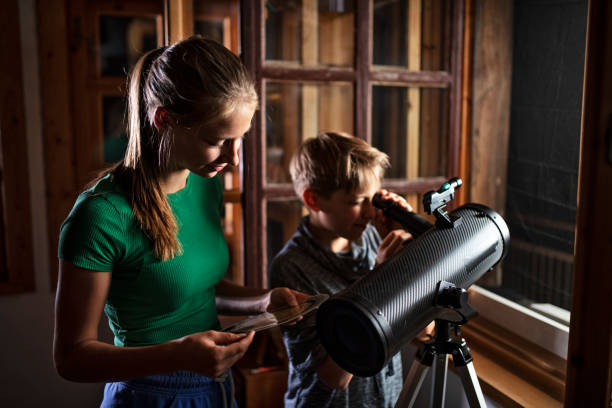 Brother and sister observing the moon and the stars Brother and sister are using the astronomy telescope to observe the moon and the stars. The girl is using sky map.
Nikon D850 astronomy telescope stock pictures, royalty-free photos & images