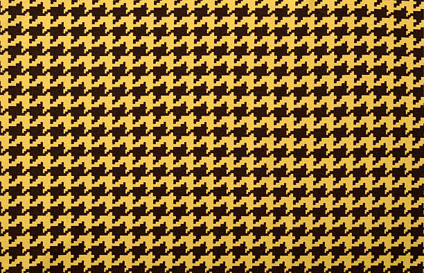 Brown and yellow houndstooth pattern. stock photo