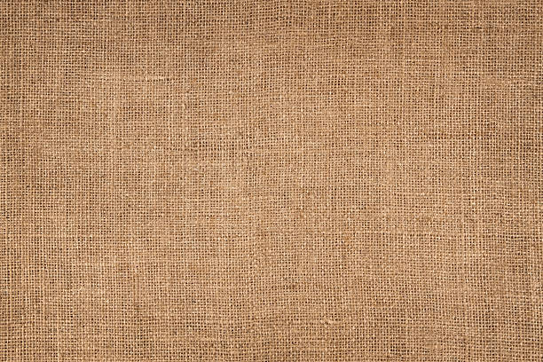 Brown Canvas Background Natural linen striped, coloured, and textured sacking burlap background. burlap stock pictures, royalty-free photos & images