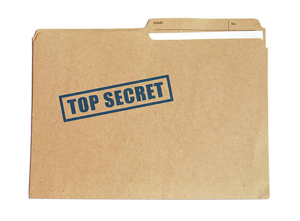 Brown card folder with top secret stamped on it in blue Top secret folder top secret stock pictures, royalty-free photos & images