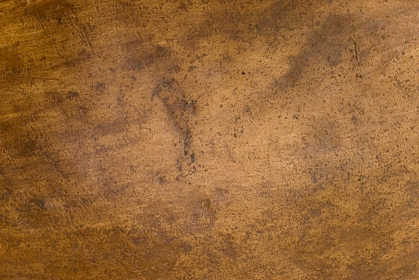A brown, copper-textured background stock photo