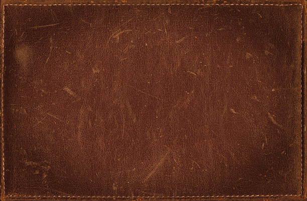 brown grunge background from distress leather texture with stitched frame - kahverengi stok fotoğraflar ve resimler