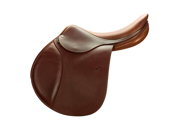 Brown Leather English Show Jumping Saddle-Side View A Side View of a Brown Leather English Show Jumping Saddle against a white background saddle stock pictures, royalty-free photos & images