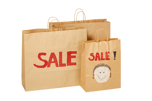 Brown Paper Shopping Bags With Sale And Face On It Stock Photo - Download Image Now - iStock