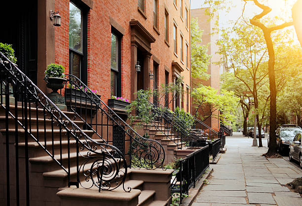 Brownstone and sidewalk in Brooklyn Heights, NY A View from idyllic Brooklyn Heights, Brooklyn, New York City, USA. Short depth of field. brooklyn new york stock pictures, royalty-free photos & images