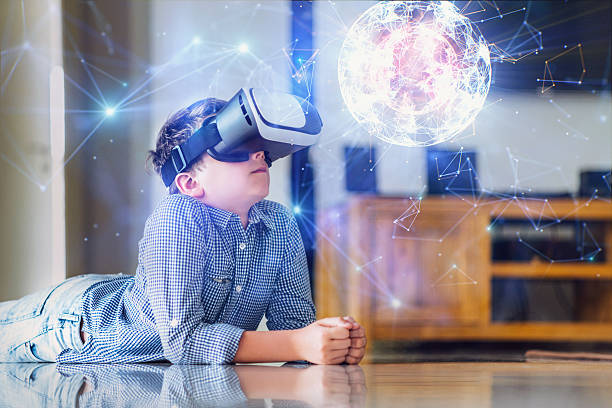browsing a virtual world in virtual reality glasses - future kids stockfoto's en -beelden