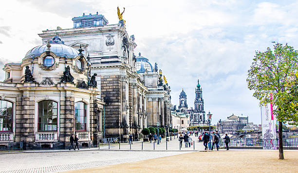 Bruehls Terrace, Dresden Dresden, Germany - October 21, 2014: People strolling along the famous Bruehls Terrace, in the histopric city of Dresden, Germany, at the river Elbe. In the background is the royal palace and the catholic court church. bruehl stock pictures, royalty-free photos & images
