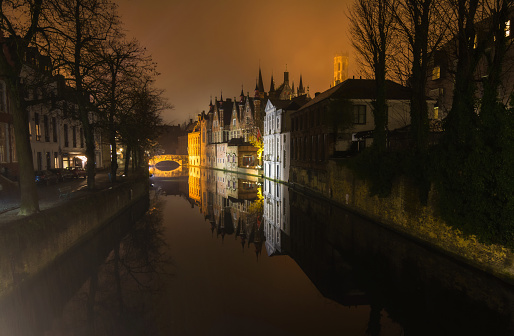 Typical Bruges houses reflected in the canal.
