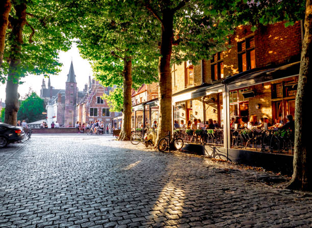 001-19 Bruges at sunset view Bruges' bridges  from a tree-lined road brugge belgium stock pictures, royalty-free photos & images