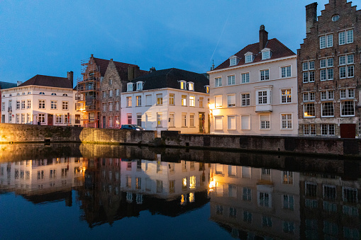 The historic city center of Bruges, Belgium at dusk in the springtime.