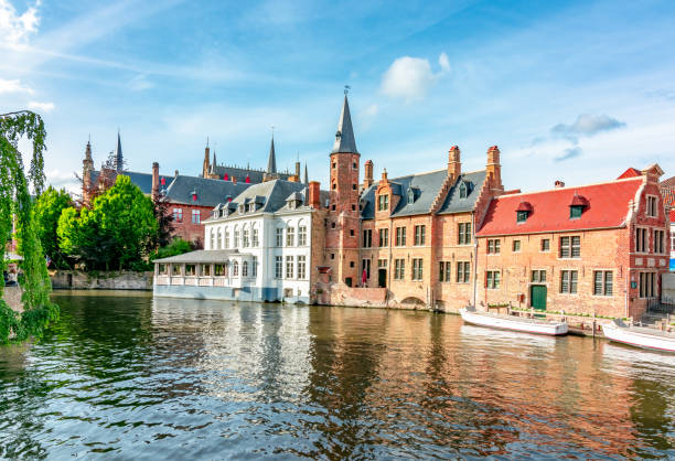 Bruges canals and medieval architecture, Belgium Bruges canals and medieval architecture, Belgium bell tower tower stock pictures, royalty-free photos & images