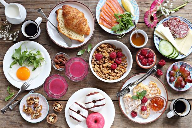 Brunch. Brunch. Family breakfast or brunch set served on rustic wooden table. Overhead view, copy space brunch stock pictures, royalty-free photos & images