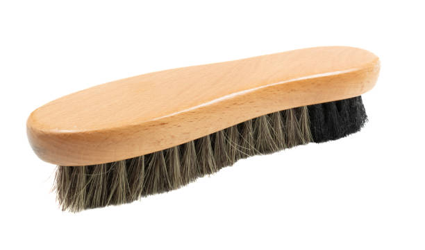 brush for cleaning shoes on a white background close-up stock photo