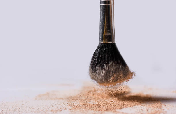 brush on touching make up powder on white background stock photo
