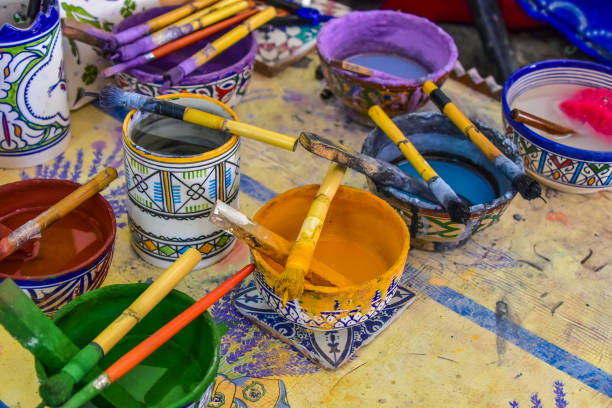 Brushes and paints in an artist's studio, Morocco stock photo