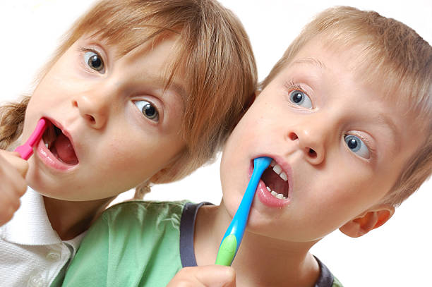 brushing teeth children stock photo