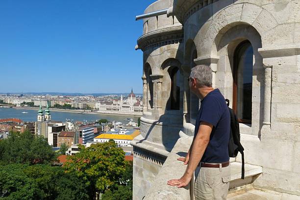 Budapest, Hungary tourist looks at Danube River from Fisherman’s Bastion stock photo