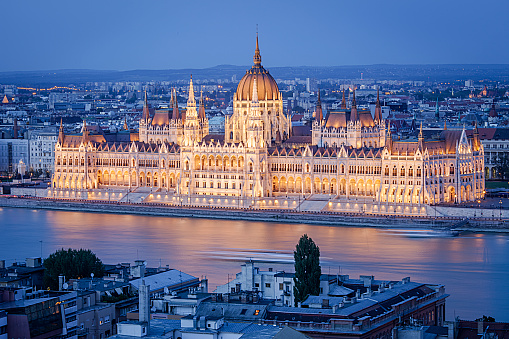 Budapest Parliament, Hungary. The Parliament building on the Danube river in Budapest, Hungary. Budapest is a large european city and the Hungarian capital with more than 1,7 million inhabitants