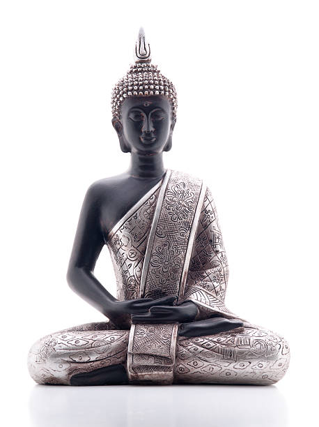 Buddha "Statue of Buddha in lotus position, front view, isolated on white background, with reflection.Click for more Buddha images." buddha stock pictures, royalty-free photos & images