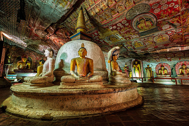 Buddha statue inside Dambulla cave temple, Sri Lanka Buddha statue inside Dambulla cave temple, Sri Lanka. Dambulla cave temple also known as the Golden Temple of Dambulla is a World  Heritage Site in Sri Lanka, situated in the central part of the country. This site is situated 148 km east of Colombo and 72 km  north of Kandy. It is the largest and best-preserved cave temple complex in Sri Lanka. This temple complex dates back to the first century BCE. There are more than 80 documented caves in  the surrounding area. Major attractions are spread over 5 caves, which contain statues and paintings. These paintings and statues  are related to Lord Buddha and his life. There are total of 153 Buddha statues, 3 statues of Sri Lankan kings and 4 statues of  gods and goddesses. dambulla stock pictures, royalty-free photos & images