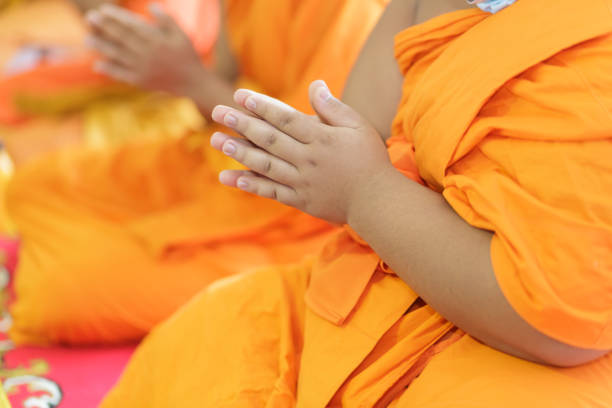 Buddhist monk's hand Is in the ceremony stock photo