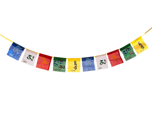 Buddhist prayer flag In the Tibetan Himalayas where they are hung on the mountain passes and mountain peaks for the wind to recite the mantras printed on them. tibetan culture stock pictures, royalty-free photos & images