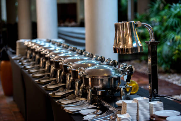 Buffet Table with Row of Food Service Steam Pans stock photo