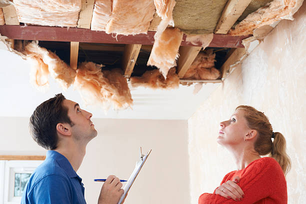 Builder And Client Inspecting Roof Damage Estimating insurance claim collapsing stock pictures, royalty-free photos & images