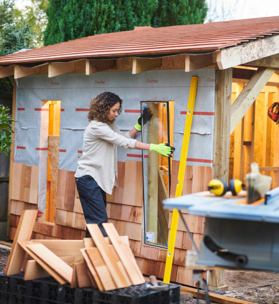 building a garden room woman glazing her part built shed shed stock pictures, royalty-free photos & images