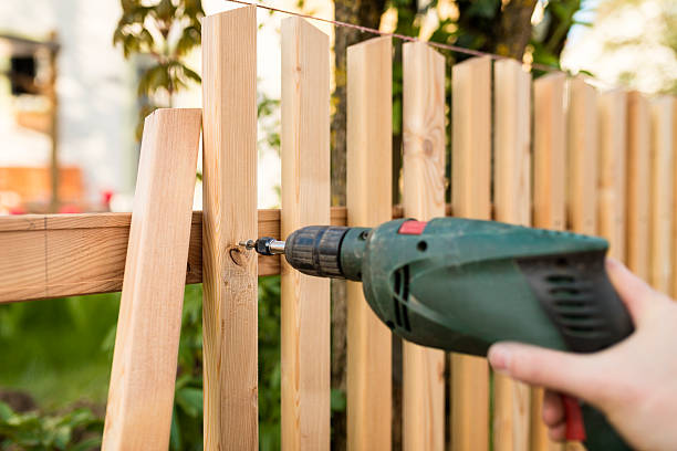 building a wooden fence stock photo