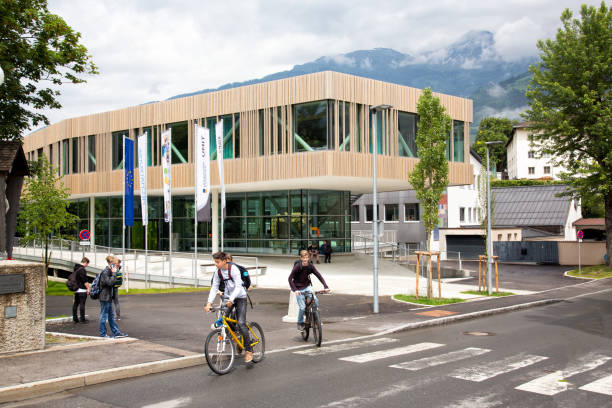 Building and students leaving the Tech Campus vocational school in Lienz Lienz, Austria - May 2018. Modern architecture building and students at the Tech Campus vocational school in Lienz. hohe tauern range stock pictures, royalty-free photos & images