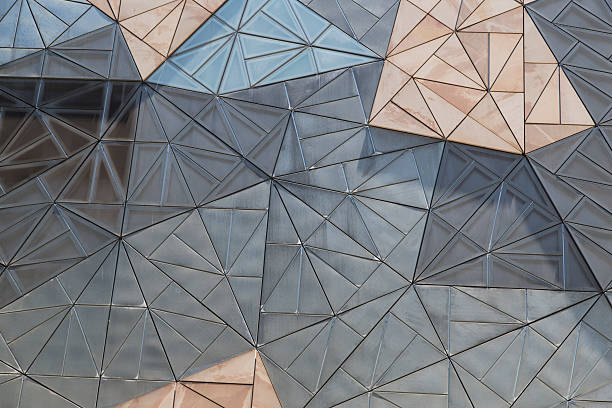 Building Facade Interesting pattern on the facade of a building at Federation Square, Melbourne, Australia federation square stock pictures, royalty-free photos & images