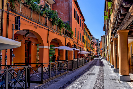 Bologna, Italy - July 9, 2022: Building facades and medieval architecture along the streets in Bologna