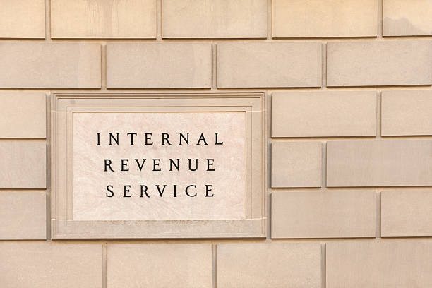 IRS building Sign on IRS headquarter building in downtown Washington, DC irs stock pictures, royalty-free photos & images