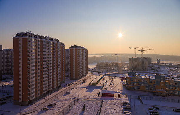 Buildings on the background of sunrise and the sun Buildings on the background of sunrise and the sun eko hotel stock pictures, royalty-free photos & images