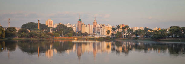 Buildings reflected in the dam at dawn - Panoramic photography - Sao Jose do Rio Preto - Brazil stock photo