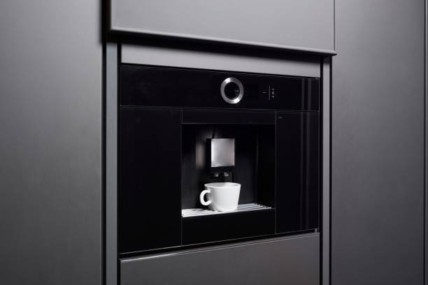 Built-in coffee machine in contemporary kitchen stock photo