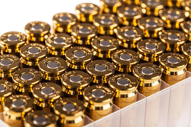 Bullet box a pack full of unused 9mm bullets isolated on white ammunition stock pictures, royalty-free photos & images