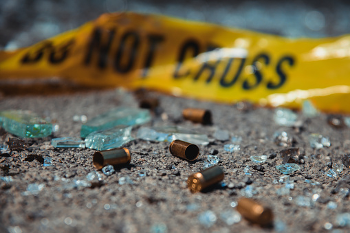 Bullet casings and broken glass. Crime scene.