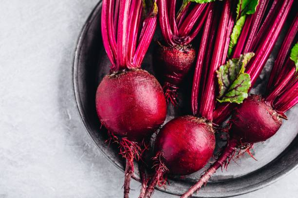 Bunch of fresh raw organic beets with leaves stock photo