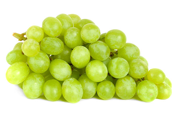 Bunch of Green Grapes laying A shot of a bunch of green grapes, laying and isolated on white. grape photos stock pictures, royalty-free photos & images