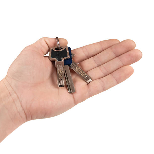 Bunch of keys on hand. stock photo