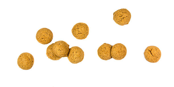 bunch of scattered ginger nuts from above - pepernoten stockfoto's en -beelden
