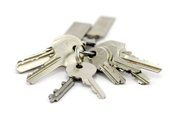 A bunch of silver keys on keychain stock photo