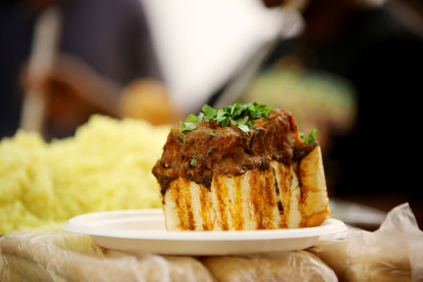 Bunny Chow Meal An indian inspired curry and bread fast food meal known as a bunny chow in South Africa durban stock pictures, royalty-free photos & images